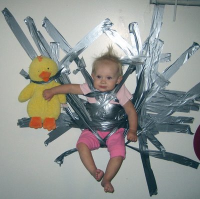 baby duct taped to wall
